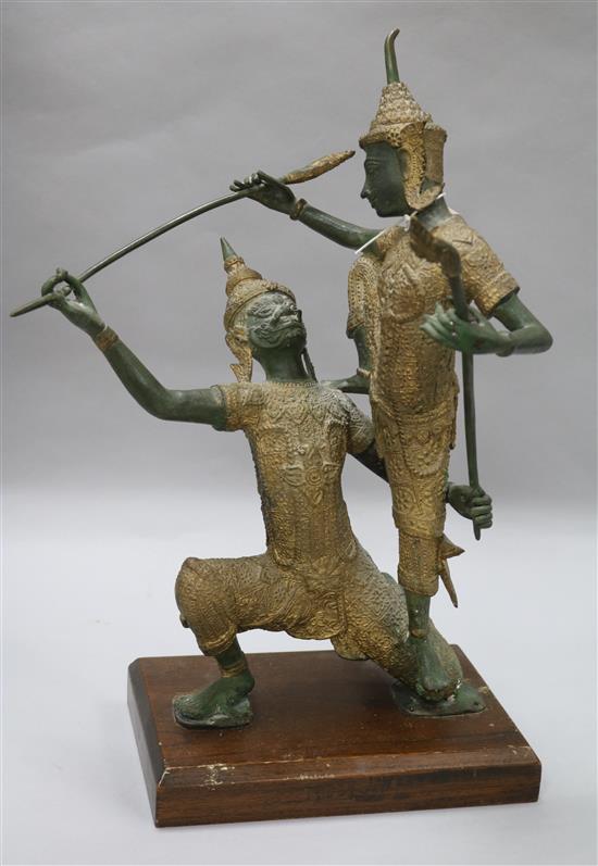 An Indonesian bronze group of two deities fighting, H approx 50cm (overall)